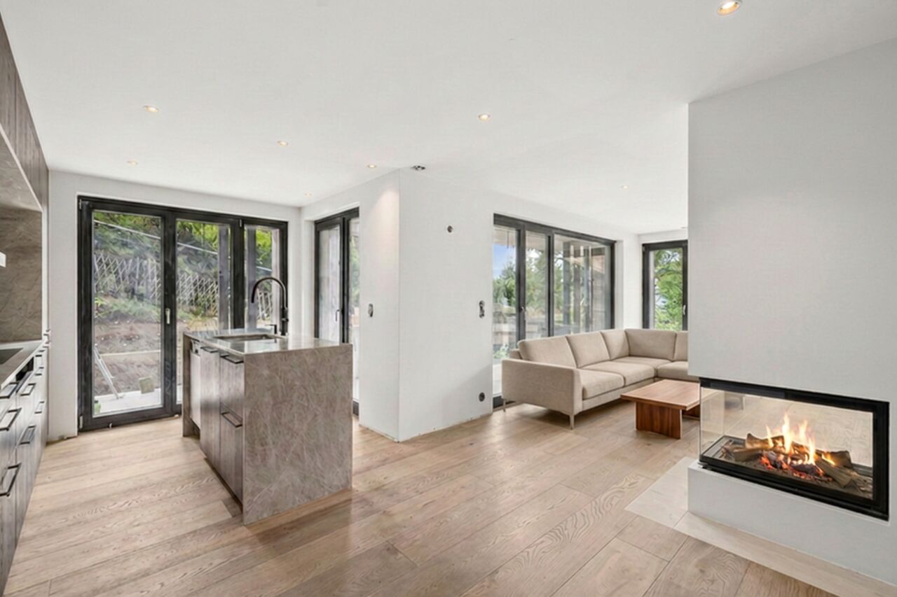 Appartement neuf à Villars-sur-Ollon — séjour avec cheminée